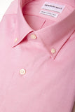 Peach Oxford Button Down shirt folded with close up of fabric