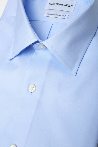 Solid Blue shirt folded with close up of fabric