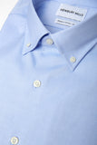 Blue Oxford Button Down Shirt Folded. Fabric Closeup.