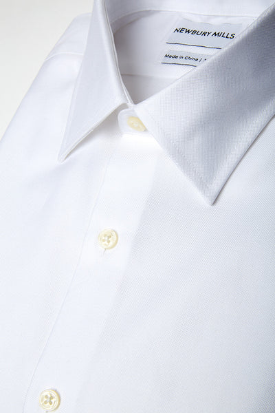 Solid White shirt folded with close up of fabric