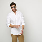 White Oxford Button Down shirt worn casually untucked with sunglasses
